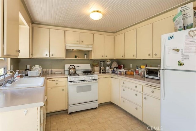 1410 Verde Canyon Rd, Arroyo Grande, CA 93420 - kitchen with white appliances, under cabinet range hood, cream cabinets, and light countertops