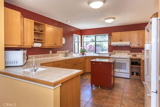1410 Verde Canyon Rd, Arroyo Grande, CA 93420 - kitchen with white appliances, under cabinet range hood, open shelves, a peninsula, and tile patterned floors