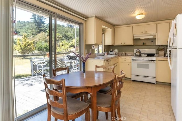 1410 Verde Canyon Rd, Arroyo Grande, CA 93420 - kitchen with white appliances, under cabinet range hood, light countertops, and cream cabinetry