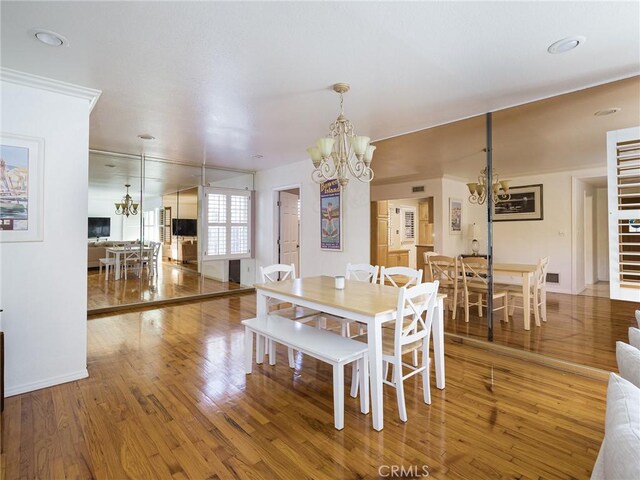 13404 Arcturus Ave, Gardena, CA 90249 - dining room with a chandelier and wood finished floors