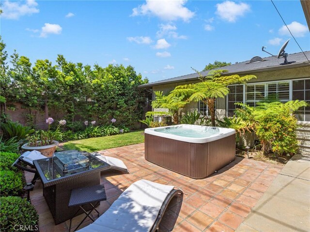 13404 Arcturus Ave, Gardena, CA 90249 - view of patio / terrace with a hot tub