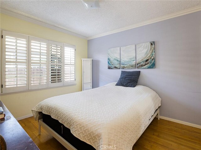 13404 Arcturus Ave, Gardena, CA 90249 - bedroom featuring crown molding, wood finished floors, and a textured ceiling