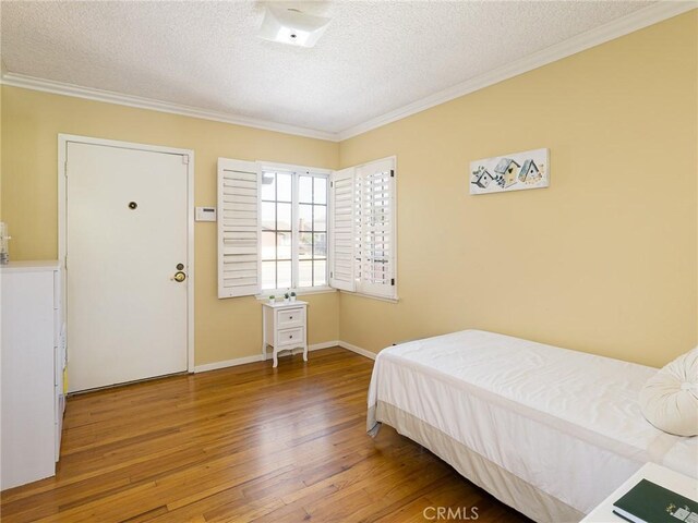 13404 Arcturus Ave, Gardena, CA 90249 - bedroom with hardwood / wood-style flooring, a textured ceiling, and ornamental molding