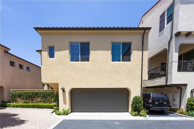 134 Milky Way, Irvine, CA 92618 - mediterranean / spanish-style house with stucco siding, driveway, and a garage