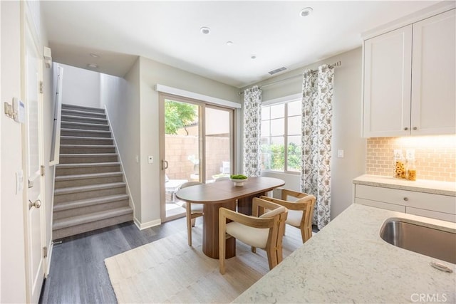 134 Milky Way, Irvine, CA 92618 - dining space with wood finished floors, stairway, and recessed lighting