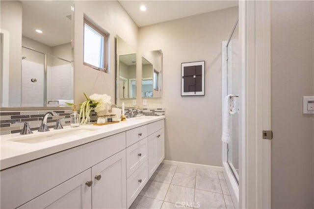 134 Milky Way, Irvine, CA 92618 - full bathroom featuring double vanity, a shower stall, backsplash, marble finish floors, and recessed lighting