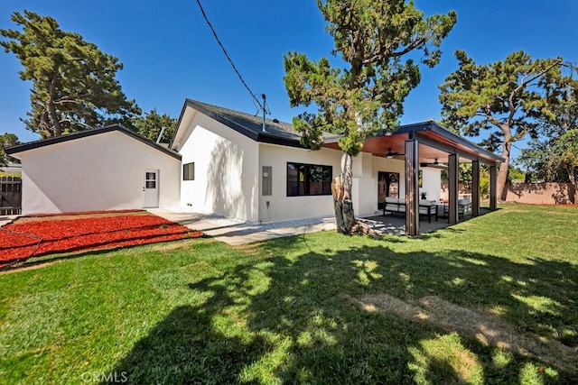 20646 Hatton St, Winnetka, CA 91306 - back of house featuring a ceiling fan, stucco siding, and a patio area