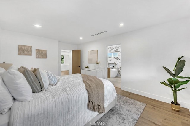 20646 Hatton St, Winnetka, CA 91306 - bedroom with light wood-type flooring and recessed lighting