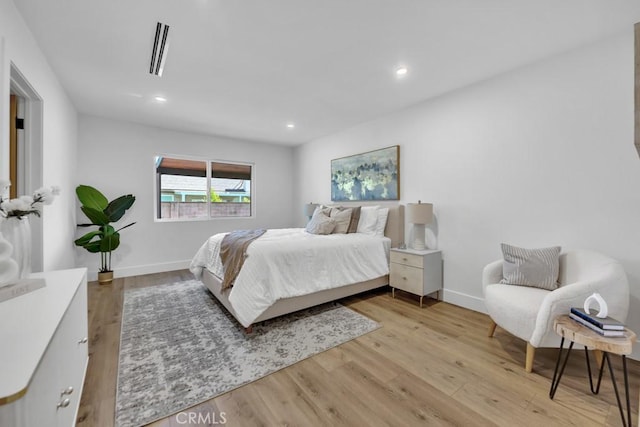 20646 Hatton St, Winnetka, CA 91306 - bedroom with light wood finished floors and recessed lighting