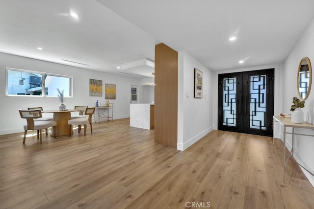 20646 Hatton St, Winnetka, CA 91306 - foyer featuring recessed lighting, light wood-type flooring, and french doors