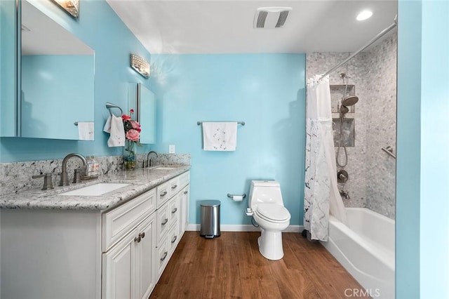 7985 Stella St, Riverside, CA 92504 - bathroom featuring double vanity, shower / bath combo, and wood finished floors