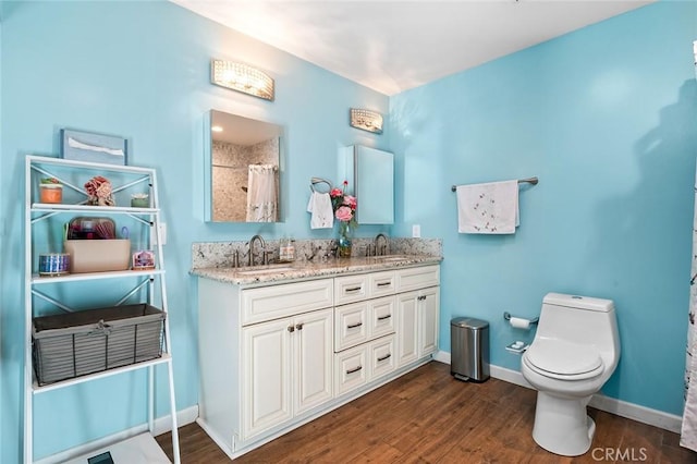 7985 Stella St, Riverside, CA 92504 - bathroom featuring double vanity, wood finished floors, and a shower with curtain