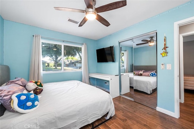 7985 Stella St, Riverside, CA 92504 - bedroom featuring dark wood-type flooring, a closet, and a ceiling fan