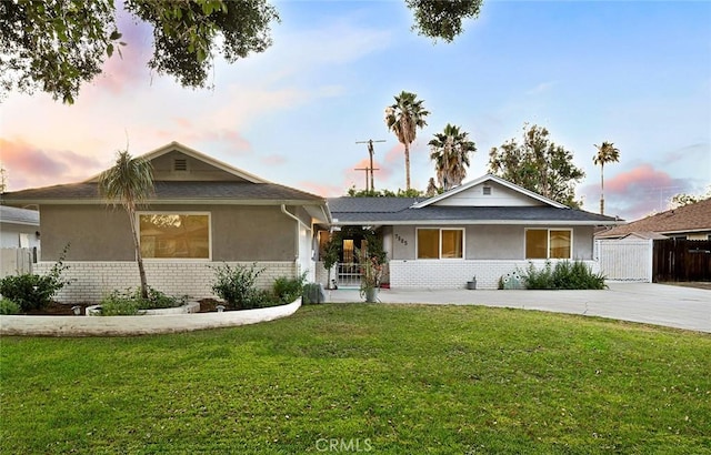 7985 Stella St, Riverside, CA 92504 - ranch-style house with stucco siding and brick siding