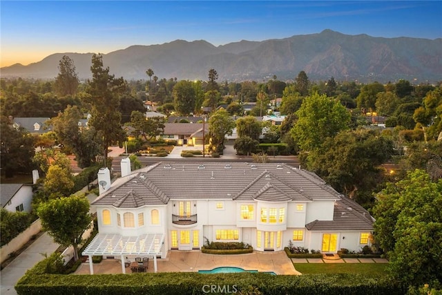 2786 E California Blvd, Pasadena, CA 91107 - rear view of property featuring a balcony, a mountain view, a chimney, a patio, and a tiled roof