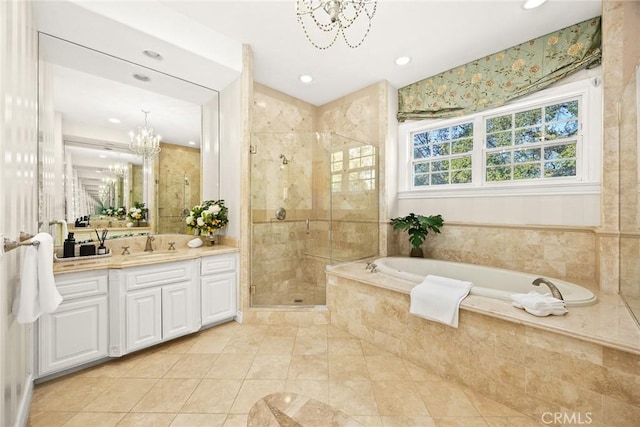 2786 E California Blvd, Pasadena, CA 91107 - bathroom featuring a chandelier, vanity, a garden tub, a shower stall, and tile patterned floors