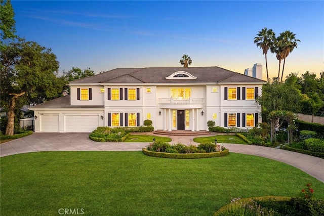 2786 E California Blvd, Pasadena, CA 91107 - view of front of house featuring a balcony, concrete driveway, a front lawn, an attached garage, and a chimney
