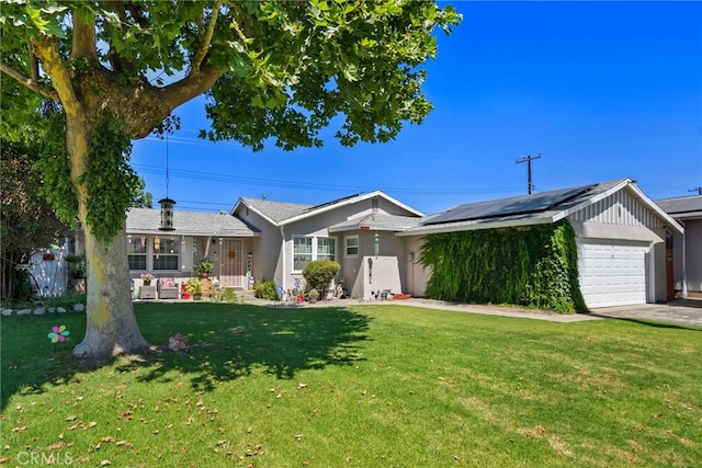 7430 Dunkirk Ave, Highland, CA 92346 - ranch-style house featuring a garage, roof mounted solar panels, a front yard, and concrete driveway