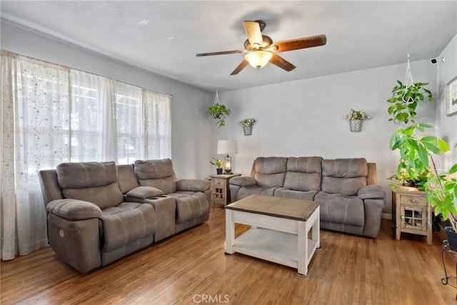 7430 Dunkirk Ave, Highland, CA 92346 - living room featuring a ceiling fan and wood finished floors
