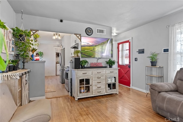 7430 Dunkirk Ave, Highland, CA 92346 - living area with light wood finished floors and healthy amount of natural light