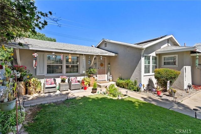 7430 Dunkirk Ave, Highland, CA 92346 - view of front of property with stucco siding, a front lawn, and outdoor lounge area
