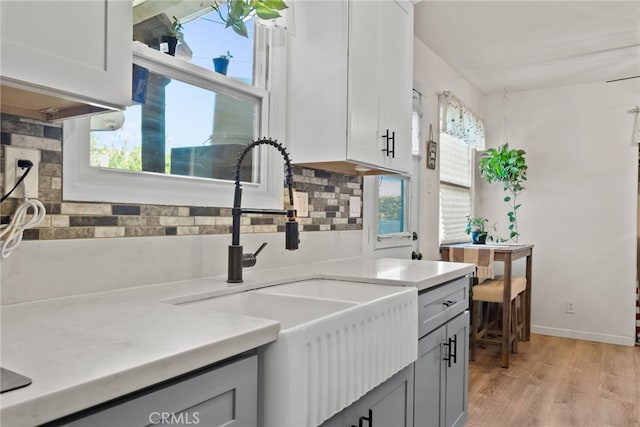 7430 Dunkirk Ave, Highland, CA 92346 - kitchen featuring light wood-type flooring, gray cabinetry, and light countertops
