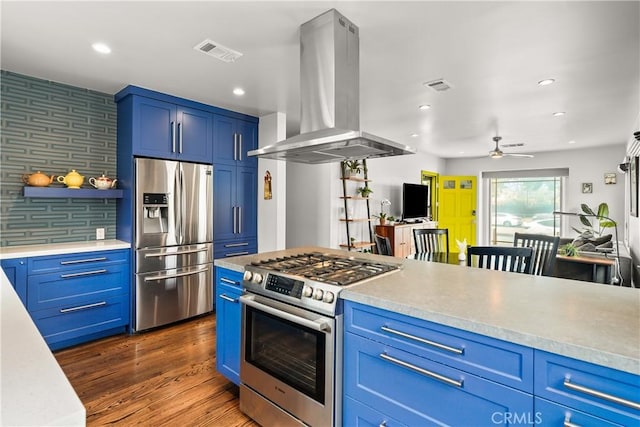 6557 Clybourn Ave, North Hollywood, CA 91606 - kitchen featuring appliances with stainless steel finishes, island exhaust hood, blue cabinets, light countertops, and recessed lighting