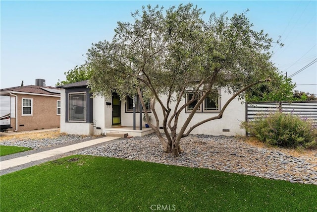 6557 Clybourn Ave, North Hollywood, CA 91606 - obstructed view of property with stucco siding, roof mounted solar panels, and crawl space