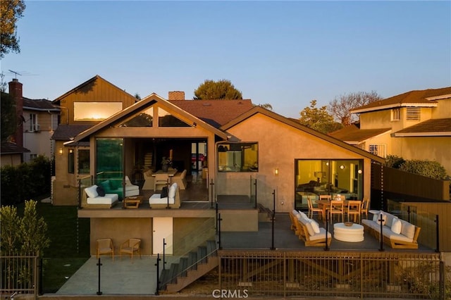 3733 Northland Dr, View Park, CA 90008 - rear view of property featuring a chimney, stairway, and stucco siding