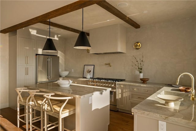 3733 Northland Dr, View Park, CA 90008 - kitchen featuring premium appliances, custom range hood, beam ceiling, light stone counters, and dark wood-style flooring
