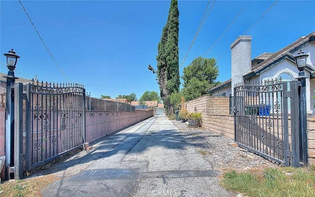 5221 Farago Ave, Temple City, CA 91780 - view of asphalt road featuring a gate