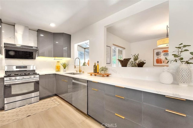 5221 Farago Ave, Temple City, CA 91780 - kitchen featuring stainless steel appliances, gray cabinets, wall chimney range hood, and light wood-type flooring