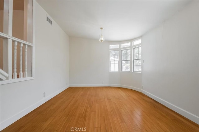 164 S Berkeley Ave, Pasadena, CA 91107 - empty room featuring light wood-type flooring and a chandelier