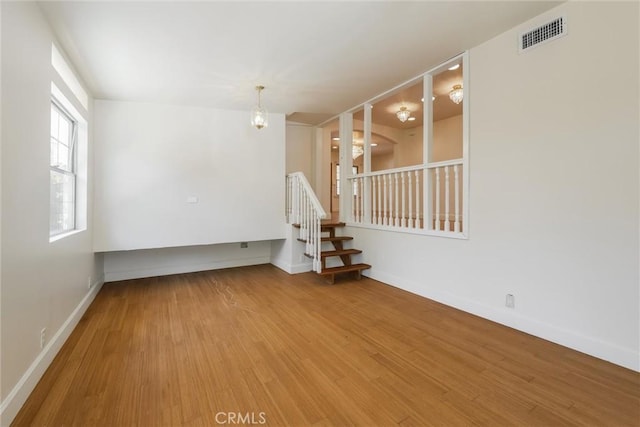 164 S Berkeley Ave, Pasadena, CA 91107 - unfurnished room featuring wood finished floors and stairs