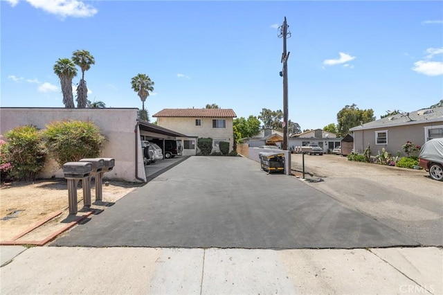 220 S Palm Ave, Santa Paula, CA 93060 - view of front of home featuring stucco siding and covered parking