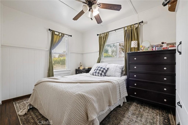 435 S Palm Ave, Santa Paula, CA 93060 - bedroom featuring multiple windows, wood finished floors, a wainscoted wall, and ceiling fan