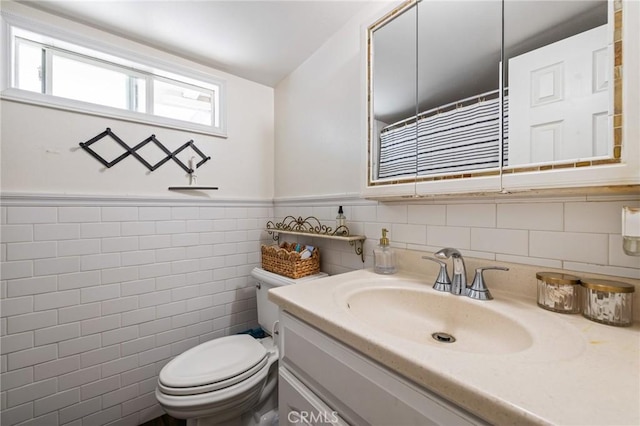 435 S Palm Ave, Santa Paula, CA 93060 - bathroom featuring vanity, a wainscoted wall, and tile walls
