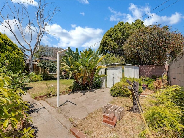 2345 22nd St, Santa Monica, CA 90405 - fenced backyard featuring a storage unit and a patio
