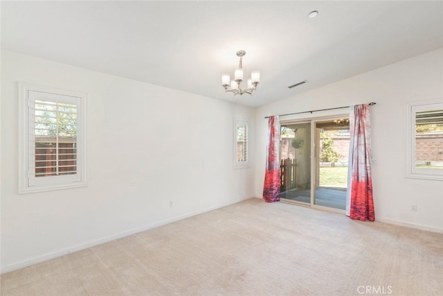 29184 Tree House, Lake Elsinore, CA 92530 - empty room with a chandelier, healthy amount of natural light, lofted ceiling, and carpet flooring