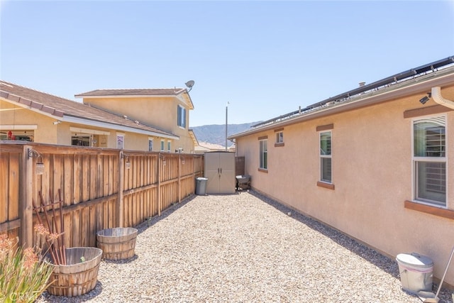 29184 Tree House, Lake Elsinore, CA 92530 - view of side of home featuring a shed, a mountain view, and stucco siding
