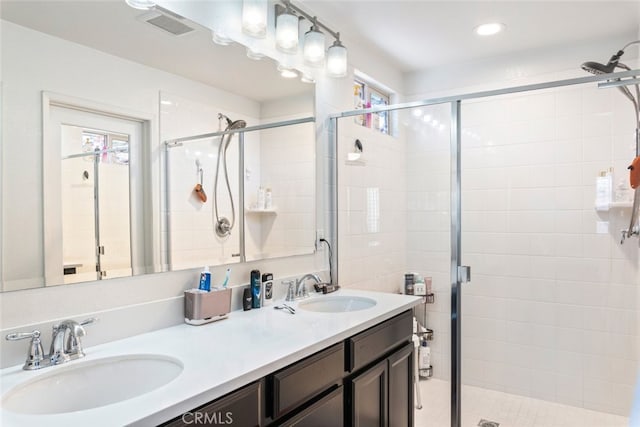 29184 Tree House, Lake Elsinore, CA 92530 - bathroom featuring double vanity, a stall shower, and recessed lighting
