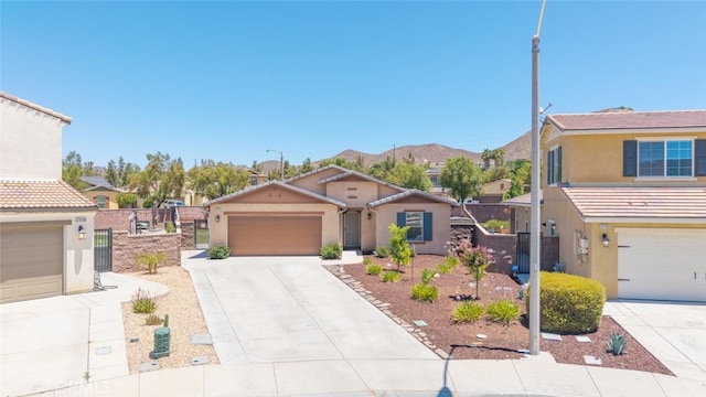 29184 Tree House, Lake Elsinore, CA 92530 - view of front of home featuring stucco siding and concrete driveway