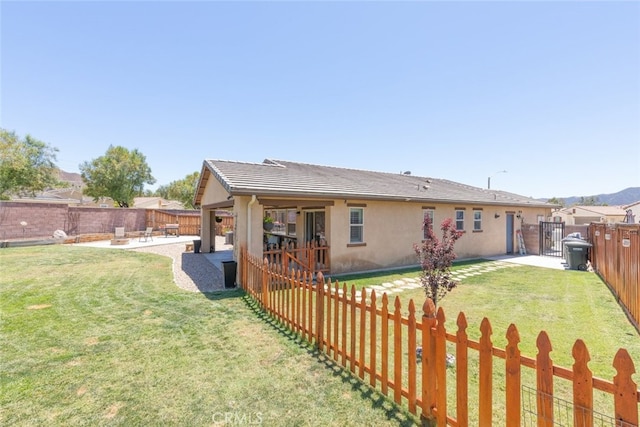 29184 Tree House, Lake Elsinore, CA 92530 - back of house with a fenced backyard, a patio, and stucco siding