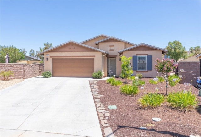 29184 Tree House, Lake Elsinore, CA 92530 - view of front facade featuring an attached garage, stucco siding, and driveway