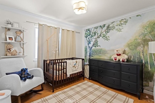 4332 Fairbrook Ln, Moorpark, CA 93021 - bedroom featuring light wood-style flooring, crown molding, and a nursery area