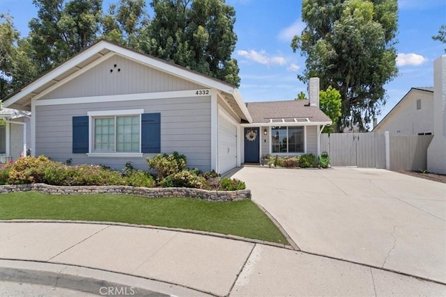 4332 Fairbrook Ln, Moorpark, CA 93021 - view of front of property featuring concrete driveway, an attached garage, and a chimney