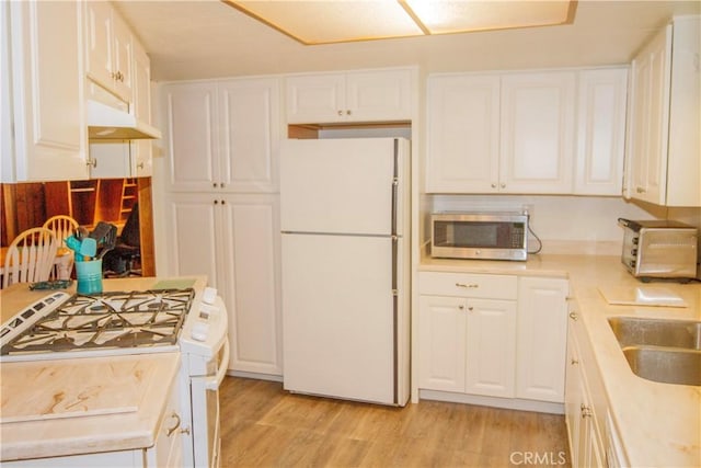 46424 Baldpate Ln, Squaw Valley, CA 93675 - kitchen featuring white appliances, light wood finished floors, light countertops, white cabinets, and under cabinet range hood