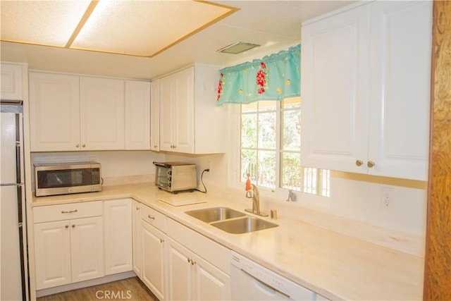 46424 Baldpate Ln, Squaw Valley, CA 93675 - kitchen with white appliances, white cabinets, and light countertops