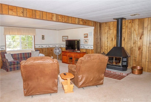 46424 Baldpate Ln, Squaw Valley, CA 93675 - living room featuring carpet, wood walls, a wood stove, and wainscoting