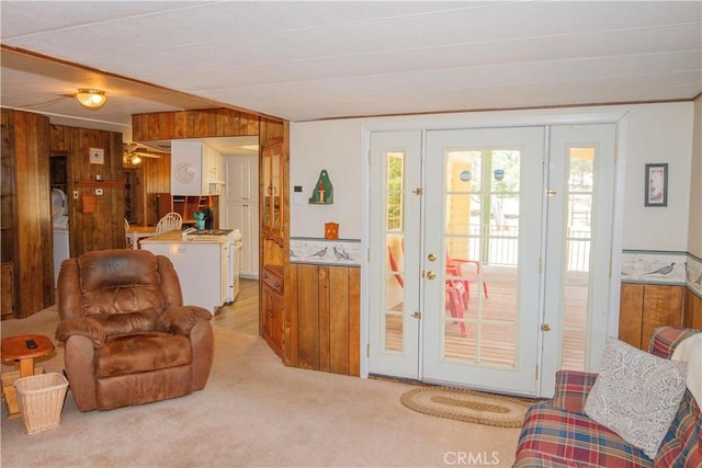 46424 Baldpate Ln, Squaw Valley, CA 93675 - living area featuring wooden walls, plenty of natural light, light colored carpet, and french doors